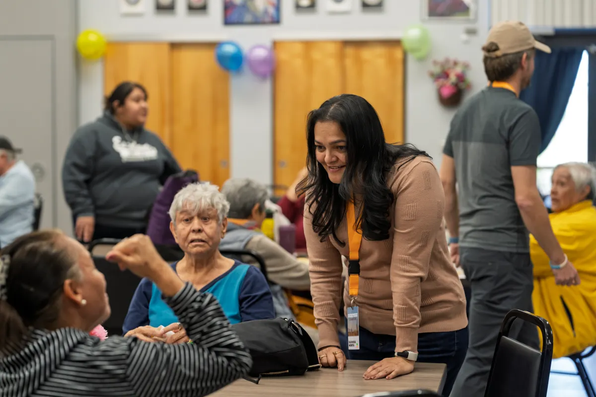 SunFire employees meet with seniors during a retreat event.